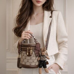 Cocoa Luxe Bear & Bunny Charm Bucket Bag”